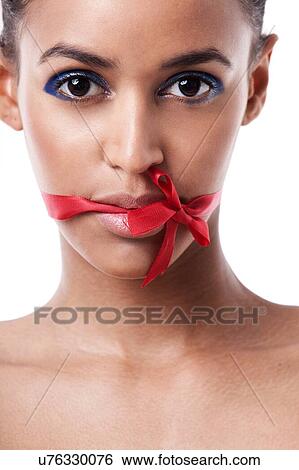Red bow tied over womans mouth View Large Photo Image Stock Photograph - Red bow tied over womans mouth. Fotosearch
