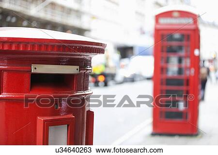 Stock Image - Red telephone booth and mail box. Fotosearch