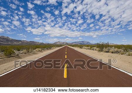 Remote Kelbaker road leading below cloudy sky View Large Photo Image Picture - Remote Kelbaker road leading below cloudy sky. Fotosearch