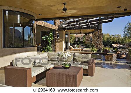 Seating furniture in luxurious patio of manor house View Large Photo Image Stock Photo - Seating furniture in luxurious patio of manor house. Fotosearch