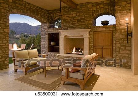 Seating furniture with fireplace in patio of mansion View Large Photo Image Stock Image - Seating furniture with fireplace in patio of mansion. Fotosearch