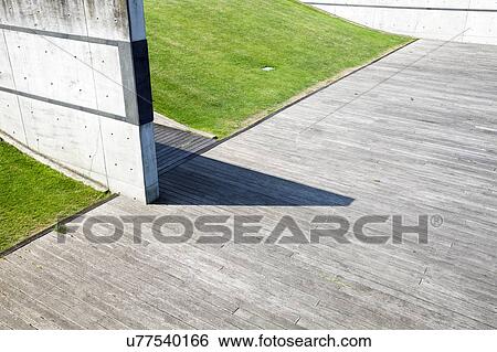 Stock Photograph - Shadow on the concrete floor from wall. Fotosearch