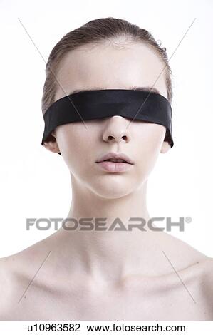 Shirtless young woman blindfolded against white background View Large Photo Image Stock Image - Shirtless young woman blindfolded against white background. Fotosearch