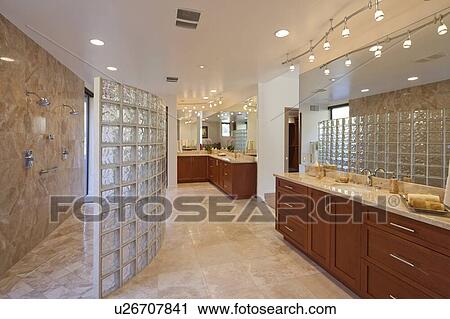 Stock Image - Shower, sink and counter in Bathroom. Fotosearch