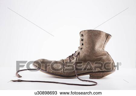 Stock Image - Side view of traditional European shoe over white background. Fotosearch