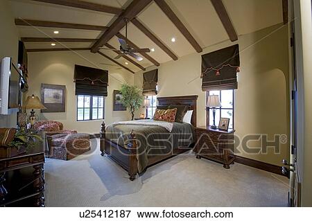 Stock Photo - Spacious bedroom interior of luxury mansion. Fotosearch