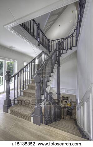 Stock Image - Staircase landing of traditional house. Fotosearch
