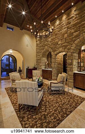 Stock Image - Stylish living room with high ceiling. Fotosearch