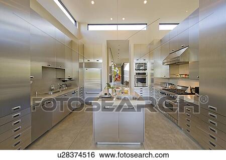 Stock Photograph - Stylish modern kitchen in manor house. Fotosearch
