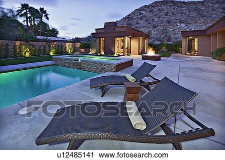 Sun lounges by the pool View Large Photo Image Stock Image - Sun lounges by the pool. Fotosearch