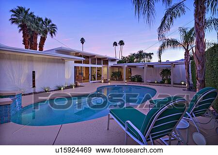 Stock Photo - Sun lounges by the pool. Fotosearch