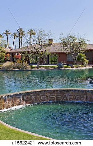 Swimming pool in front of luxurious manor house View Large Photo Image Stock Image - Swimming pool in front of luxurious manor house. Fotosearch