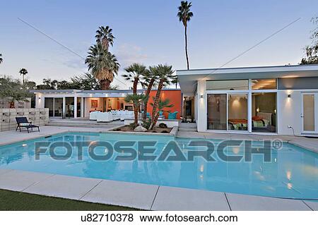 Swimming pool in front of luxurious villa View Large Photo Image Stock Photo - Swimming pool in front of luxurious villa. Fotosearch