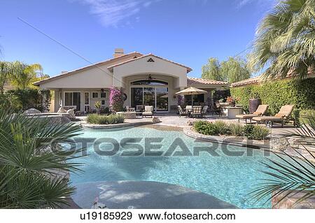 Stock Photo - Swimming pool in luxury villa. Fotosearch