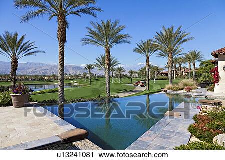 Stock Image - Swimming pool of luxurious villa. Fotosearch