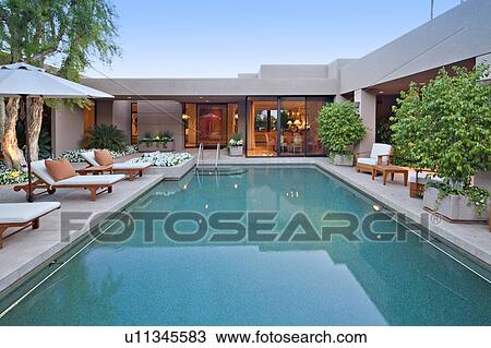 Swimming pool with chaise lounge in manor house View Large Photo Image Stock Image - Swimming pool with chaise lounge in manor house. Fotosearch