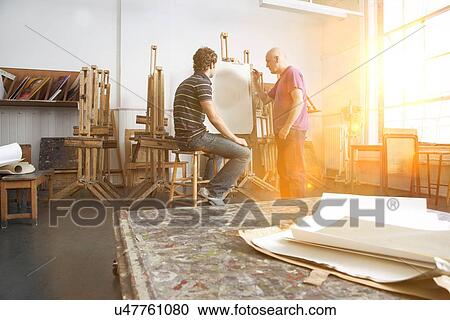 Teacher and student painting in artist studio View Large Photo Image Stock Image - Teacher and student painting in artist studio. Fotosearch
