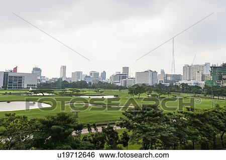 Stock Photograph - The 18 hole golf course at Royal Bangkok Sports Club in the middle of Bangkok City; Thailand. Fotosearch