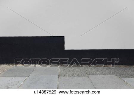 Stock Photo - Tiled floor and wall of terrace against clear sky. Fotosearch