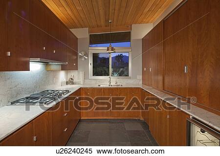 Stock Photography - Timber interior of small residential kitchen. Fotosearch