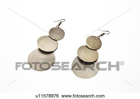 Stock Photograph - Traditional earrings over white background. Fotosearch
