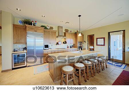 Stock Image - Traditional kitchen with breakfast bar. Fotosearch