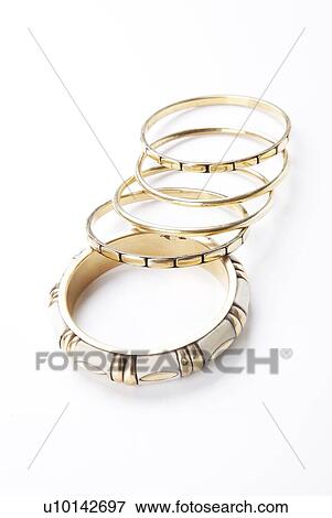 Stock Photo - Trendy bangles over white background. Fotosearch