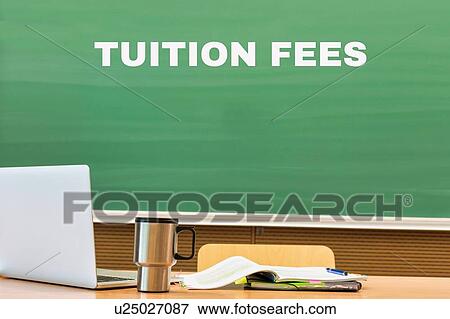 Stock Photo - Tuition fee written on black board in classroom. Fotosearch