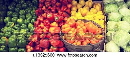 Variety of bell peppers on display for sale in market View Large Photo Image Stock Image - Variety of bell peppers on display for sale in market. Fotosearch