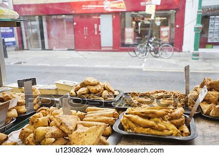 Picture - Variety of Indian food in tray for sale. Fotosearch