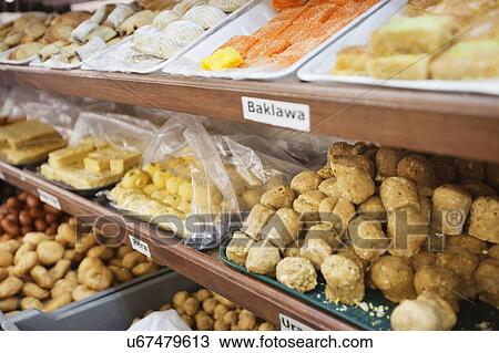 Variety of Indian sweet food displayed at store View Large Photo Image Stock Image - Variety of Indian sweet food displayed at store. Fotosearch