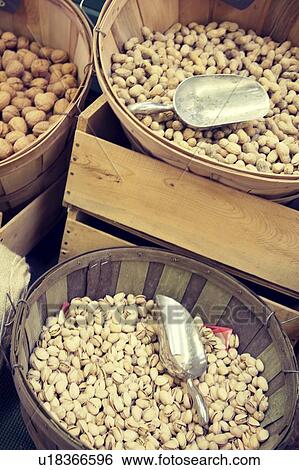 Variety of nuts on sale in Market in baskets View Large Photo Image Stock Photograph - Variety of nuts on sale in Market in baskets. Fotosearch