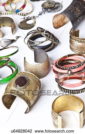 Stock Image - Variety of traditional bangles and bracelets over white background. Fotosearch