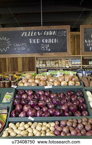 Stock Image - Vegetables on display in produce market. Fotosearch