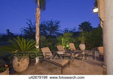 View of chaise lounge in patio of luxury manor house View Large Photo Image Stock Photo - View of chaise lounge in patio of luxury manor house. Fotosearch