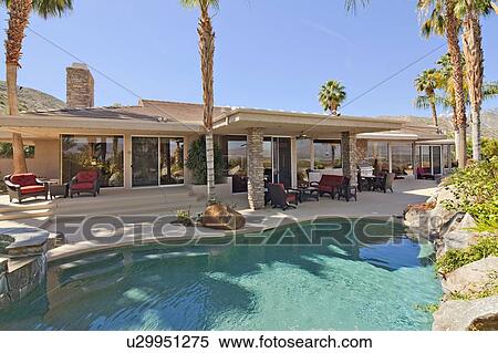 Stock Photography - View of luxury villa with swimming pool. Fotosearch
