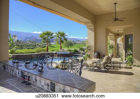 Stock Image - View of modern mansion patio. Fotosearch