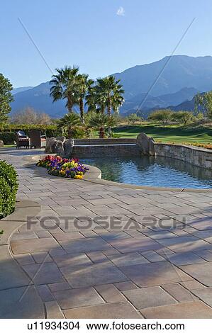 Picture - View of mountains with swimming pool of luxury manor house. Fotosearch