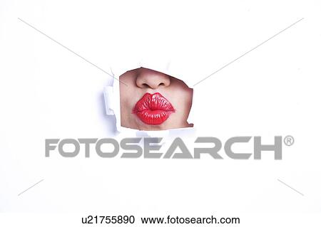 View of red puckered lips through paper hole View Large Photo Image Stock Image - View of red puckered lips through paper hole. Fotosearch