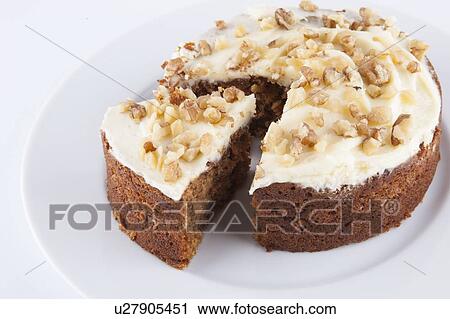 Walnut cake in plate over white background View Large Photo Image Stock Image - Walnut cake in plate over white background. Fotosearch