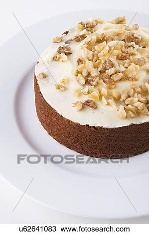 Walnut cake in plate over white background View Large Photo Image Stock Image - Walnut cake in plate over white background. Fotosearch