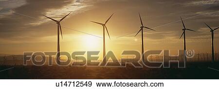 Wind farm turbines at dawn View Large Photo Image Stock Photo - Wind farm turbines at dawn. Fotosearch