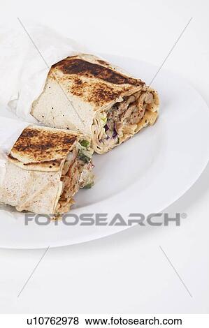 Wraps in plate over white background View Large Photo Image Stock Photo - Wraps in plate over white background. Fotosearch