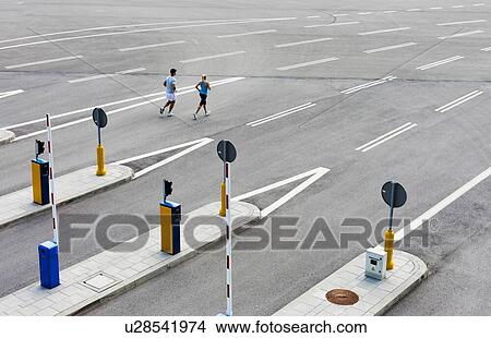Young couple excersising in the middle of the city View Large Photo Image Picture - Young couple excersising in the middle of the city. Fotosearch
