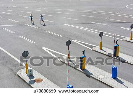 Stock Photo - Young couple excersising in the middle of the city. Fotosearch