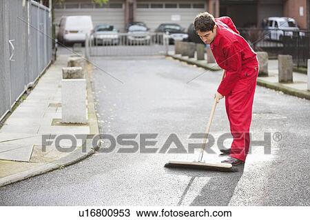 Stock Image - Young male street sweeper. Fotosearch