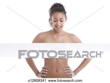 Young Mixed Race woman with hands on hips behind tape against white background View Large Photo Image Stock Image - Young Mixed Race woman with hands on hips behind tape against white background. Fotosearch