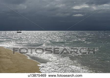 Stock Photo - Boat in the pacific ocean, Low island, Far North Queensland, Queensland, Australia. Fotosearch