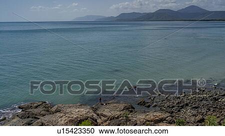 Stock Image - Elevated view on the rocky coast, Four Mile Beach, Port Douglas, Far North Queensland, Queensland, Australia. Fotosearch