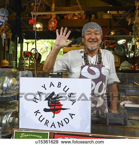 Stock Photo - Portrait of a man waving, Kuranda, Queensland, Australia. Fotosearch